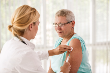 A medical professional tends to a patient.