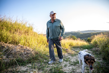 A Veteran and his companion walking outside arm in arm