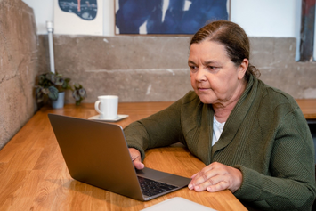 A Veteran reviewing her test results on her laptop