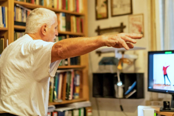 A person does a virtual workout at home.